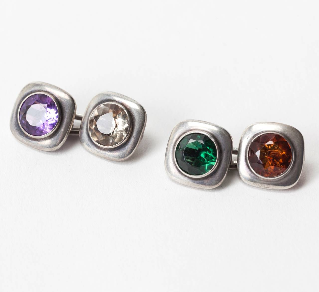 Elegant Art Deco Paste Cufflinks set in 835 silver with wonderfully colored stones, a combination of pastes and semiprecious stones. 1930's European. .5