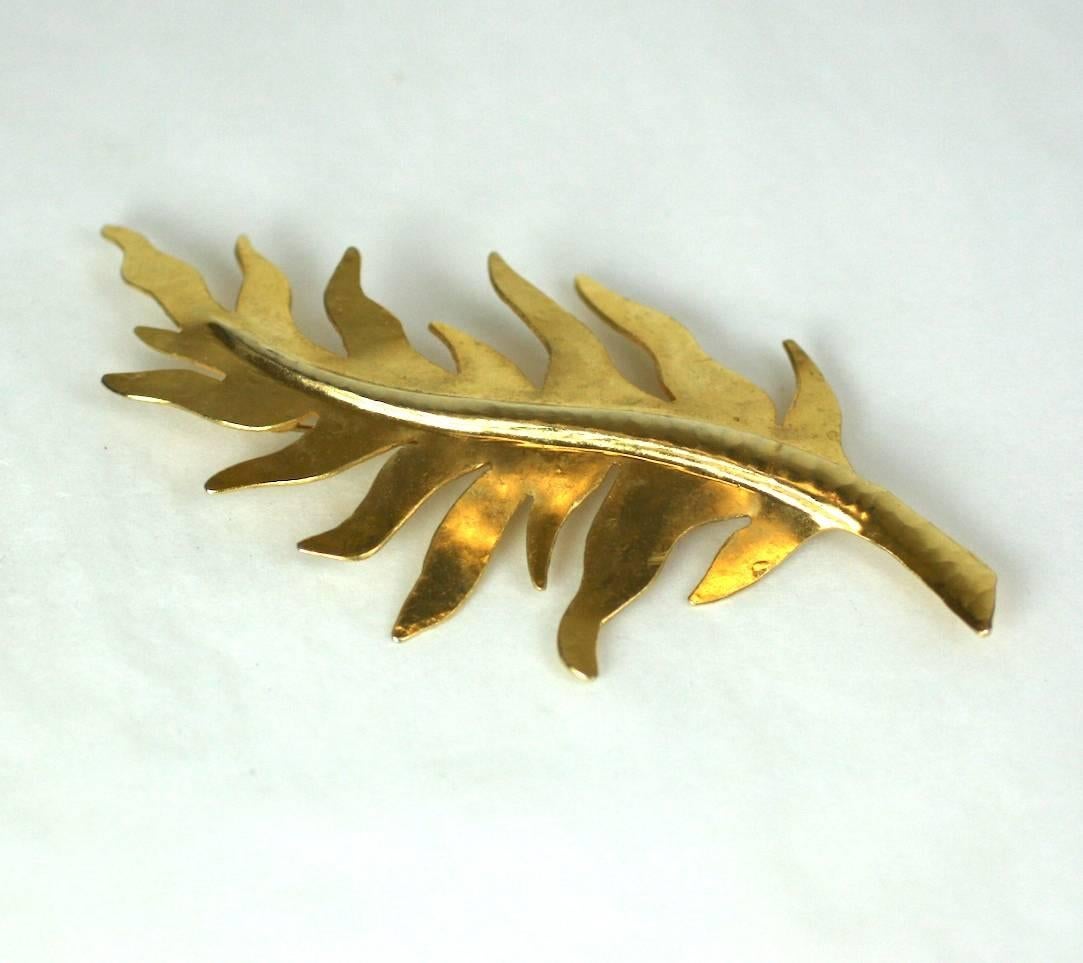 Herve Van Der Straeten Large Gilded Leaf Brooch in hand hammered brass. Hand cut metal comes alive with the dimensional hand hammering applied to the leaves. 1990's France. Excellent condition. 
5