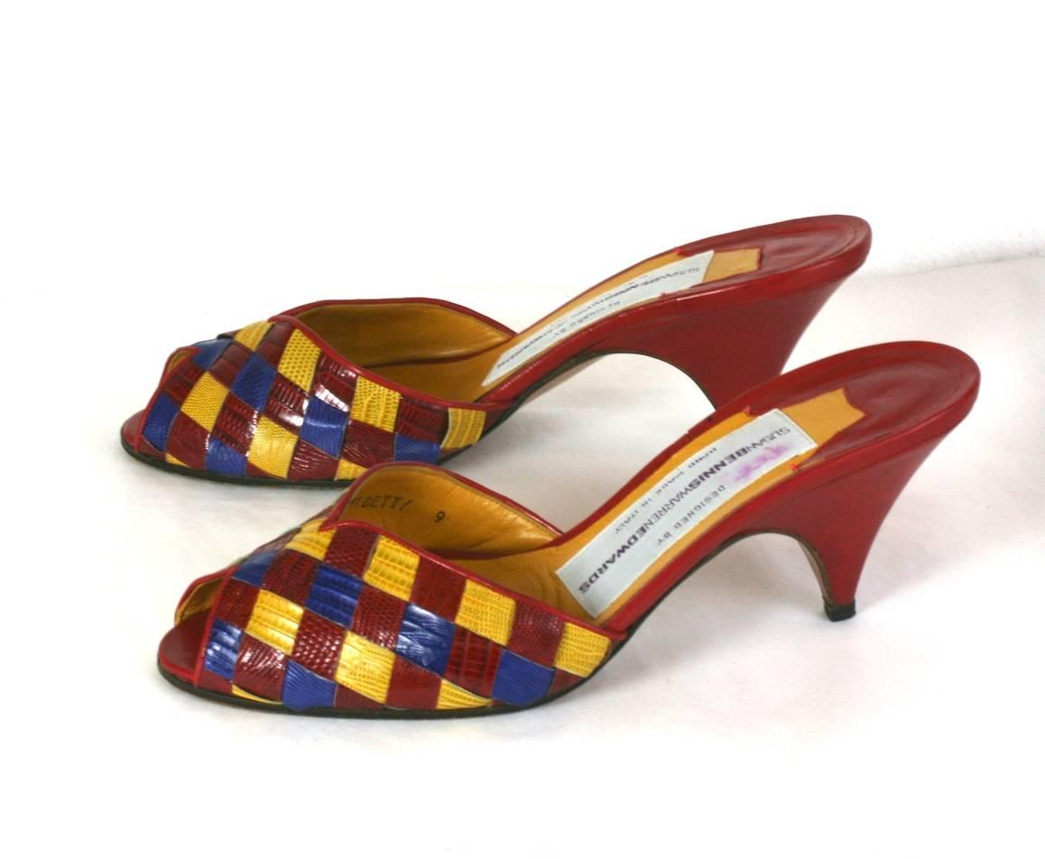 Susan Bennis Warren Edwards Colorful Woven Snakeskin Mules in bright red, yellow and purple mixed with red calf leather.  
1990's Italy. Size 9. Low tapered heel. Length 10" x 3" at widest. 
Excellent condition. 
DOMESTIC SHIPMENTS ONLY. 