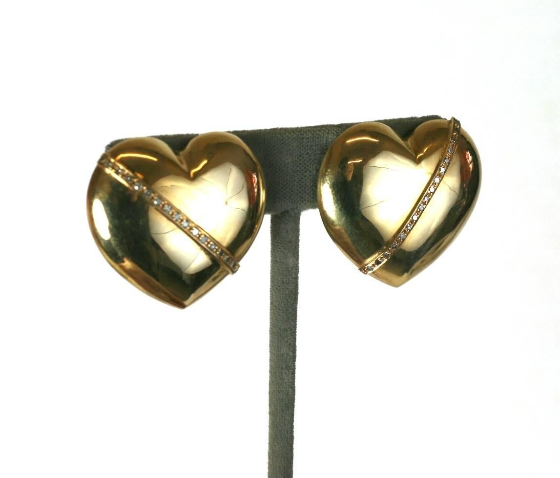 Puffy 14k Gold and Diamond Earrings with pierced fittings from the 1980's. Large in scale but light in weight as they have a hollow construction. A diagonal line of diamonds decorates each heart.
1.25