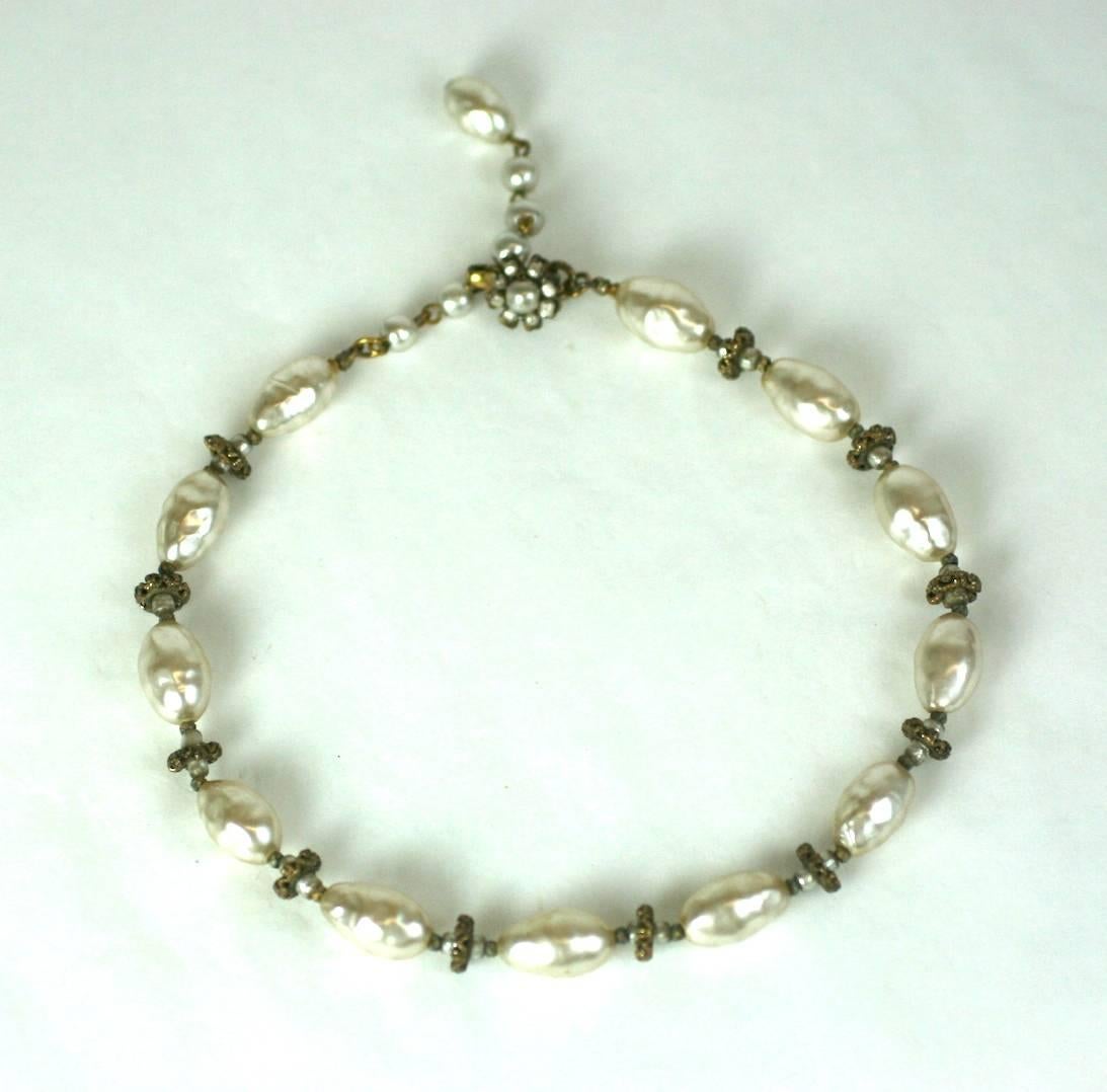 Miriam Haskell signature baroque, creamy oval faux pearls strung with gilt filigree spacers and smaller round faux pearls. Excellent condition. 1950's USA. 
13