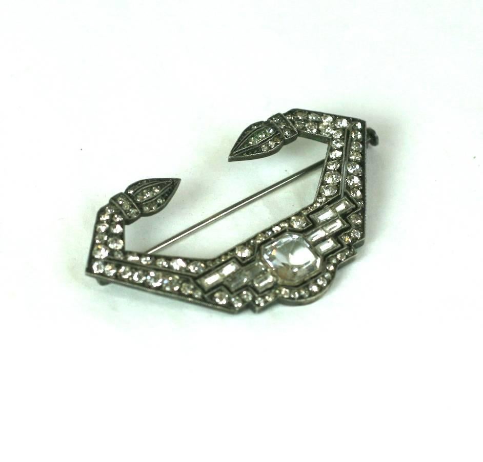 French Art Deco Paste Brooch from the 1930's. High style Deco influences from Fine jewelry with intricate step baguette and pave work. French silver hallmarks on back. 2" x 1". France 1930's.
Excellent condition. 