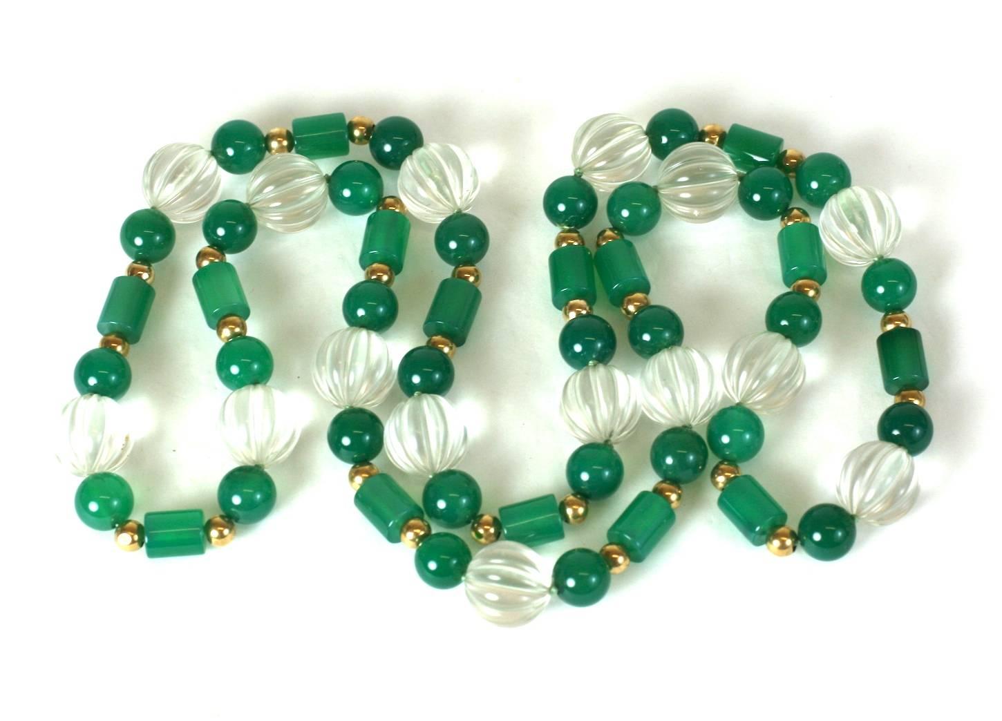 Endless strand of fluted rock crystal beads spaced with green onyx beads, toggles and 14k gold spacer beads. Loops over head with no clasp.
32