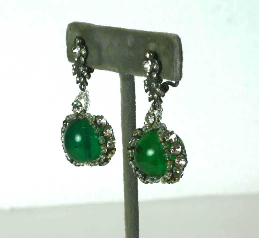 Louis Rousselet Emerald Pate de Verre and Embroidered Earrings with clip back fittings. Unusual drop formation with paste top accents with an emerald glass bead caught within a sewn cage with clear seed beads, and rhinestones. 1.75