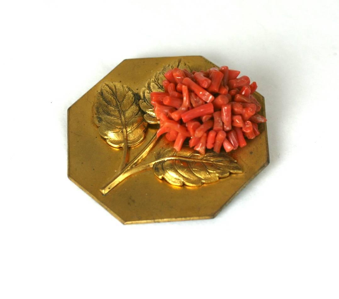 French Art Deco clip brooch. Octagonal in form with a branch coral zinnia bloom, with three realistic leaves. Rich Russian Gilding with clip back fitting.
Excellent Condition. 1930's France. 
Length 2