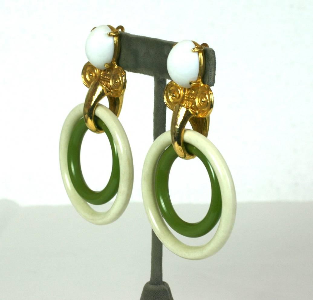 MiMi de Nardo Large Hoop Drop Earrings of gilt metal in the David Webb style.
Large resin hoops in cream and avocado hang from gilt iconic column motifs with a milk glass cabochon. 
1970's USA. Unsigned.
Excellent Condition. Clip back fittings.