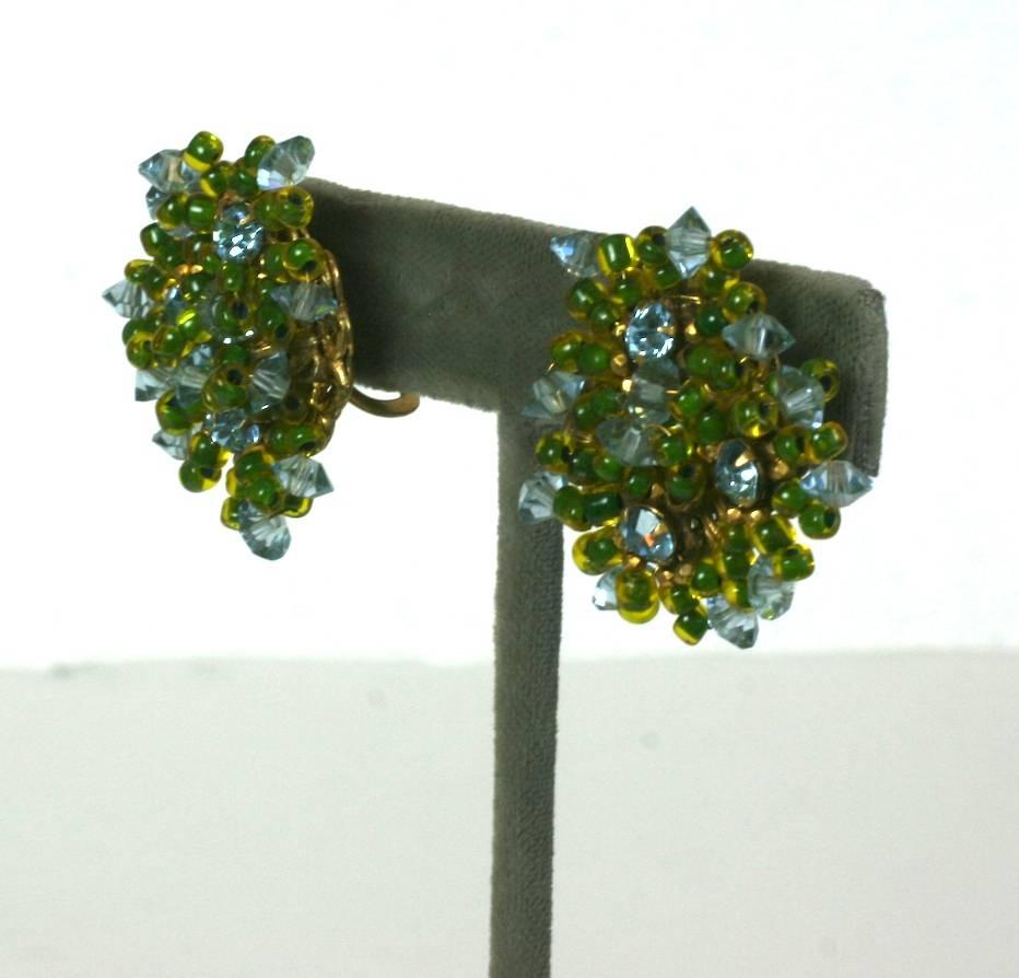 Miriam Haskell multi flower head clip earrings with aquamarine crystal and lime lined yellow seed beads all hand sewn on classic Russian gilt filigree bases.
Clip back fittings, Excellent condition. 1940's USA. 
Length 1.25"
Width  1"