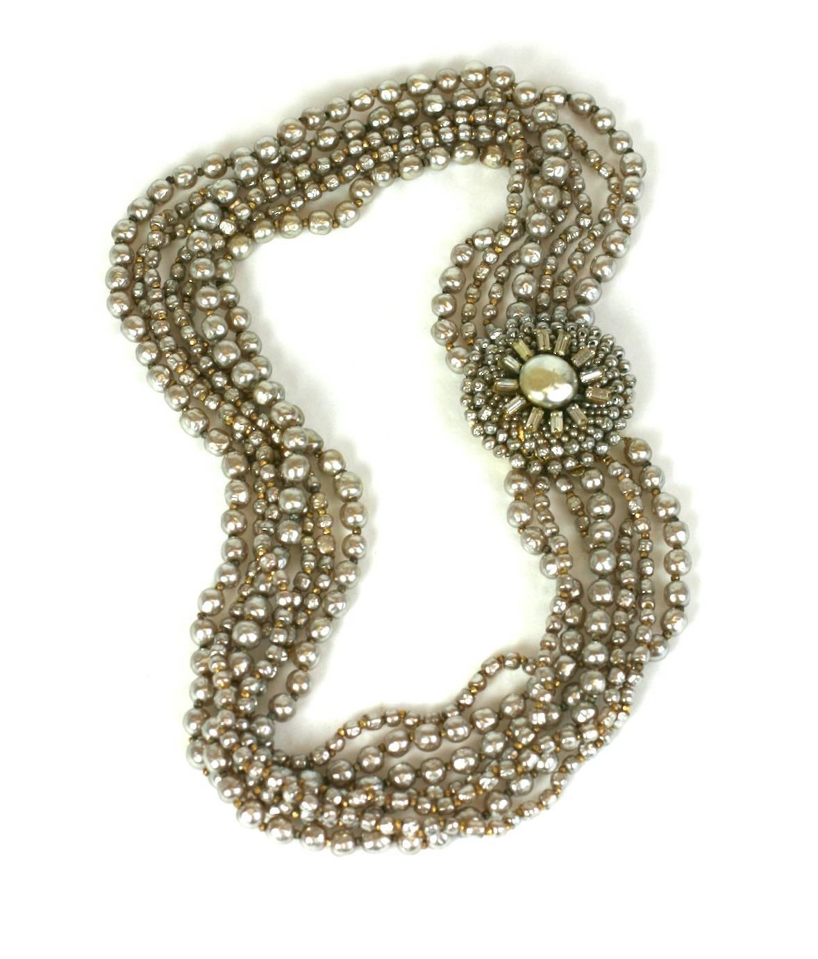 Stunning and collectible Miriam Haskell Faux Pearl Necklace of multiple strands of creamy signature faux pearls with elaborately embroidered pave baguette and faux seed pearl clasp. Miriam Haskell's vintage pearls have a wonderful creamy patina.
