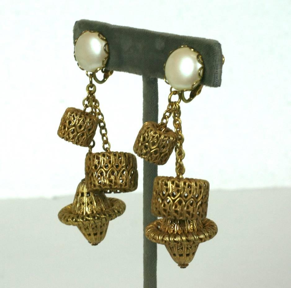 Miriam Haskell signature Russian Gilt filigree and faux pearl long ear clips. Multi drop earrings of vari shape and size filigree dangling fobs. Clip back fittings. 
Excellent Condition. 1960's USA. 
Length 3"
Width 1"
