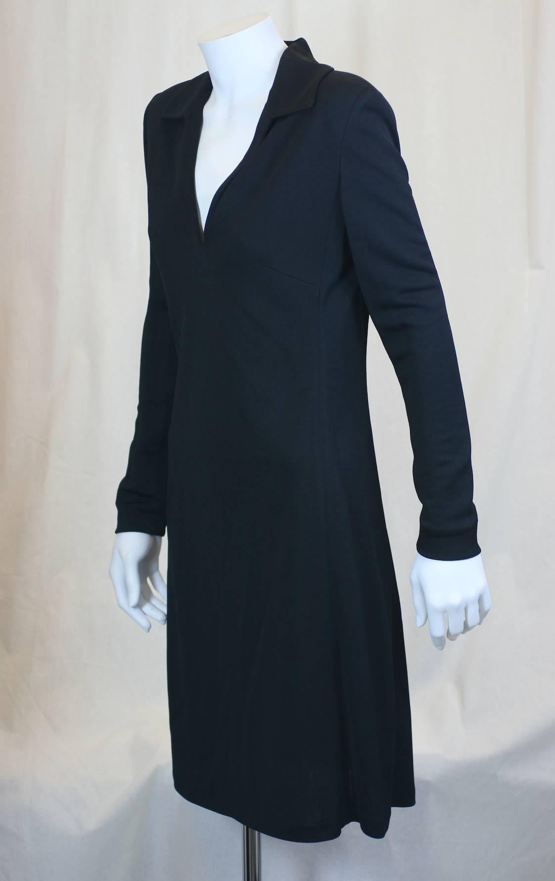 Tom Ford for Gucci black rayon jersey long sleeved V necked collared day dress with slightly flaring hem. Small size. 
Dress pulls over head. No zippers. 
Shoulders are slightly padded. Excellent Condition. 
Length 36