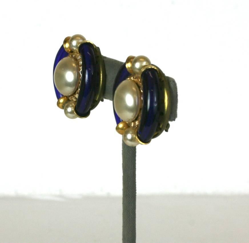 Seguso Glass and Pearl Ear Clips from the 1950's Italy. Deep blue blown glass tubes border a central faux pearl with gilt chain accents. Clip back fittings.
 Italy 1960's. Similar to other styles, possibly made for Chanel.
1.25