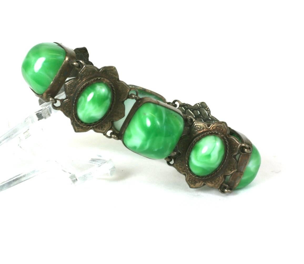 French Victorian revivalist link bracelet of bronze plate with sugar loaf cabochons of faux imperial jade of varying shapes. 1930's France. 
Marked Made in France. 
Excellent Condition
L7.50