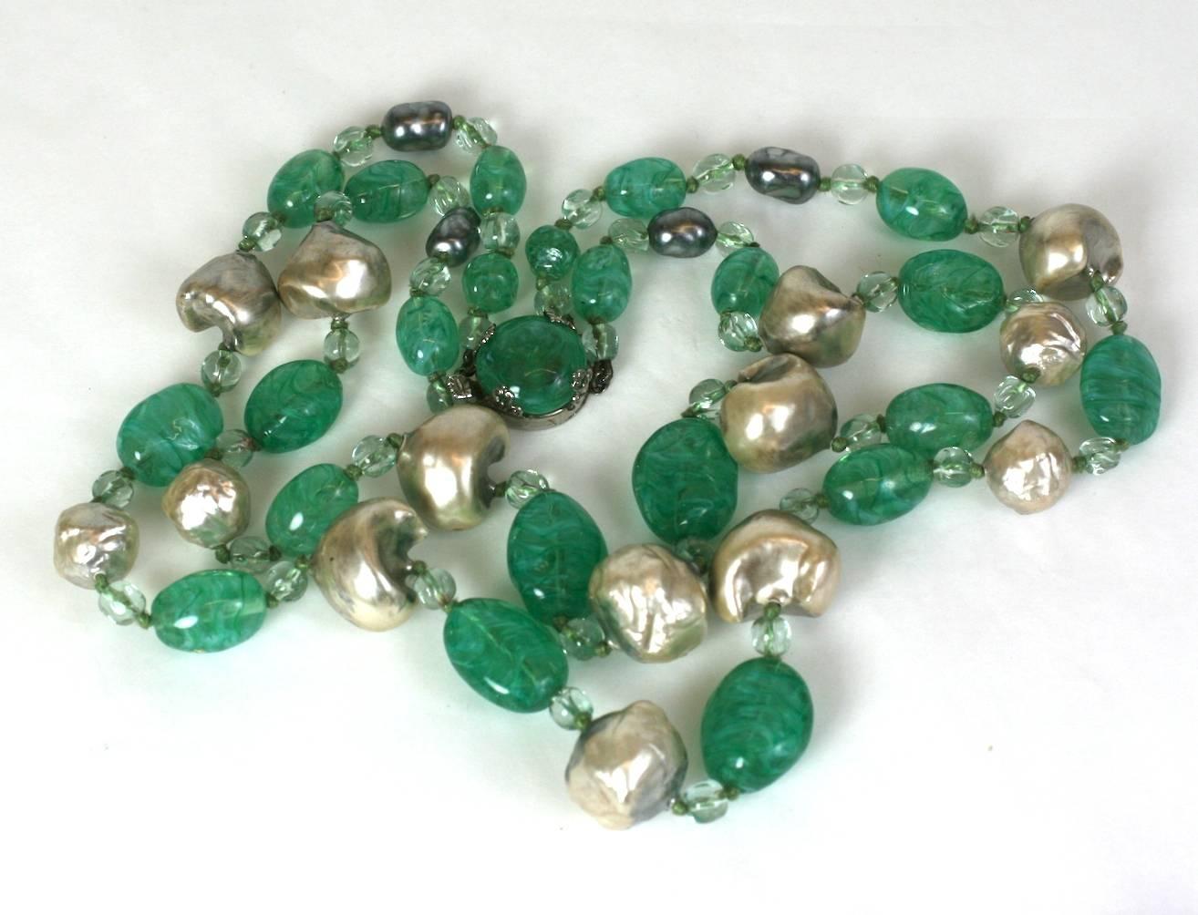 Elegant Louis Rousselet hand made naturalistic faux baroque grey pearl and faux pale emerald pate de verre double strand necklace. 1930's France. Lovely color combination. Unsigned.
Excellent Condition. 
L 21.50