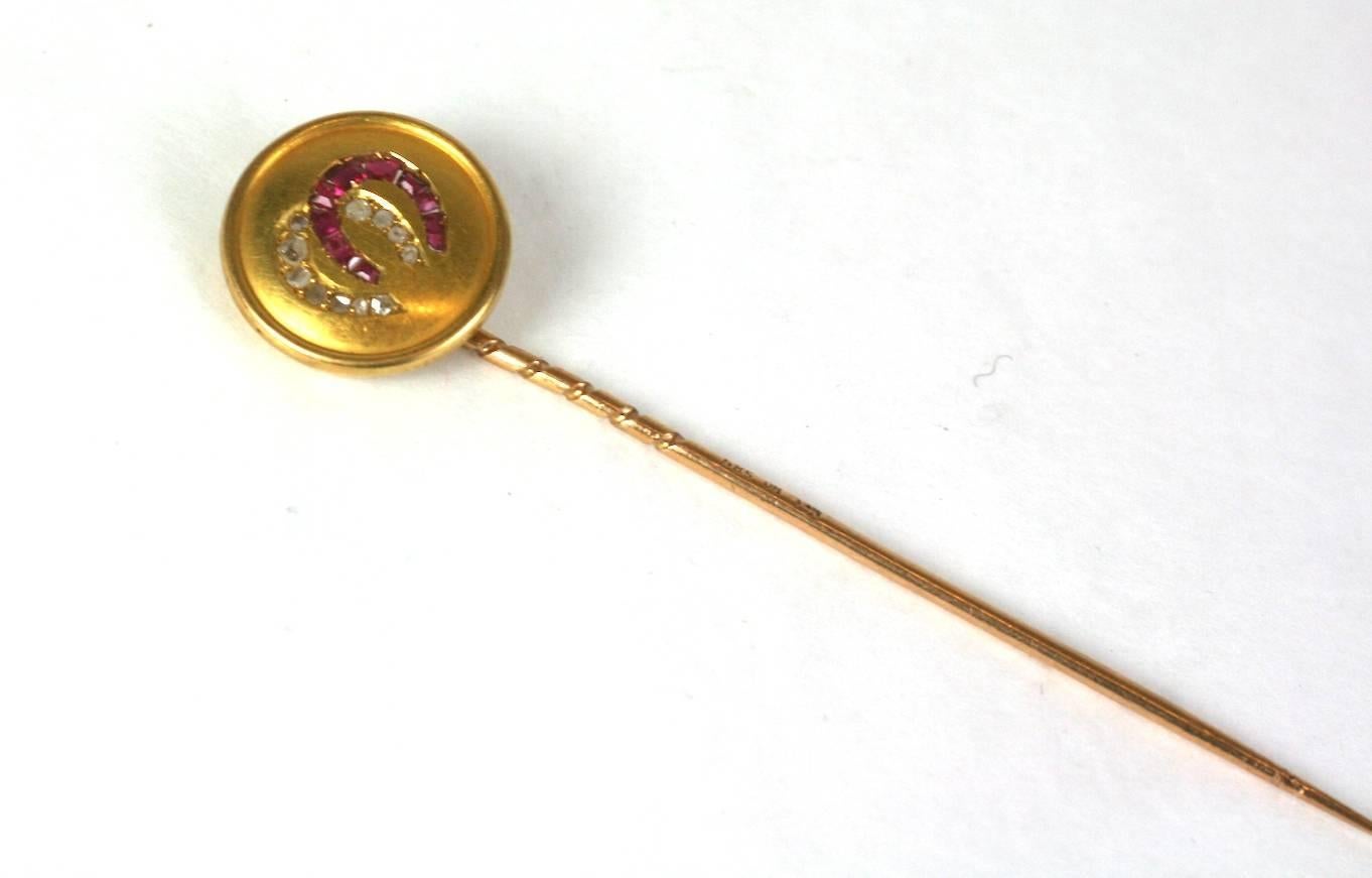 Victorian round, ruby and diamond double lucky horseshoe stickpin from the late 19th Century.
Rubies are calibre cut and set next to rose cut diamonds in 14k gold. High quality manufacture.
Excellent Condition. 1890's USA. 
Length 2.75"
Width