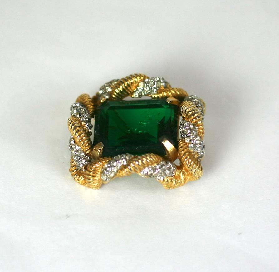 Early K.J.L. Emerald Brooch from the 1960's in the Schlumberger style.  Twisted golden rope and pave setting. The large faux emerald even has metallic flecks to replicate a real stone. 1960's USA. 
1.5" x 1.25" x .5".
Excellent