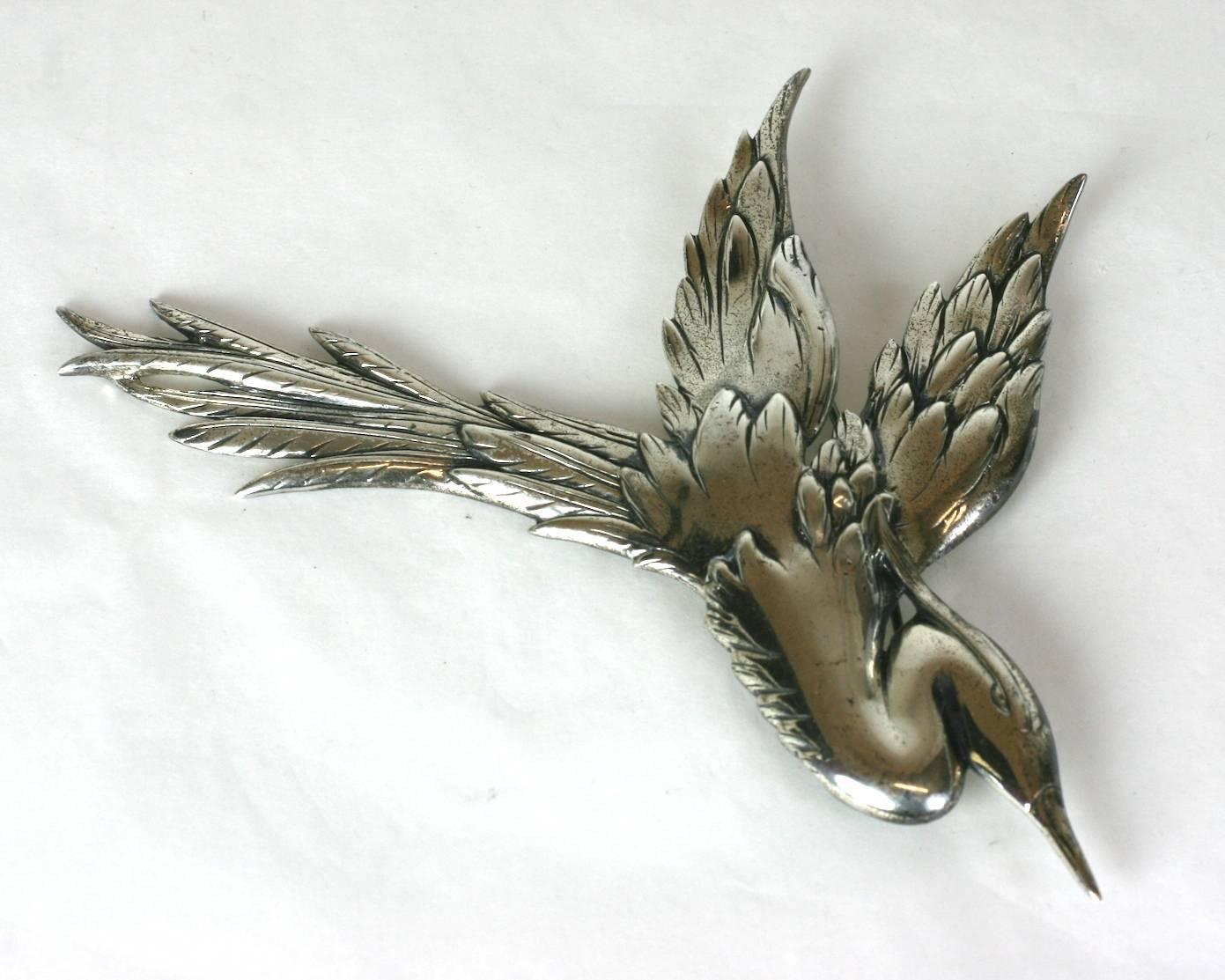 Massive Danecraft Sterling Egret Suite from the 1940's. Large egret shown in flight with fine detailing with matching earrings with screw back fittings. Sterling 1940's. Excellent condition. 

Brooch 4.5" x 4.5". earrings with screw back