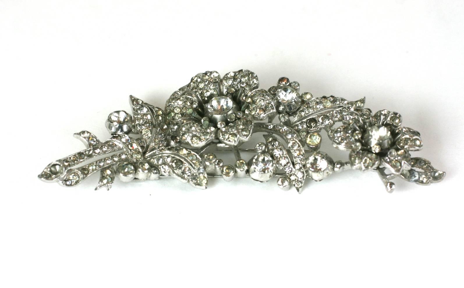 Trifari Alfred Philippe Regence Pave Georgian Revival multi tremblant rose clip brooch of rhodium plated metal, and faceted crystal rhinestones.  Marked: Trifari with Crown, 1930's USA.  Excellent condition. Clip Back Fitting.
Excellent