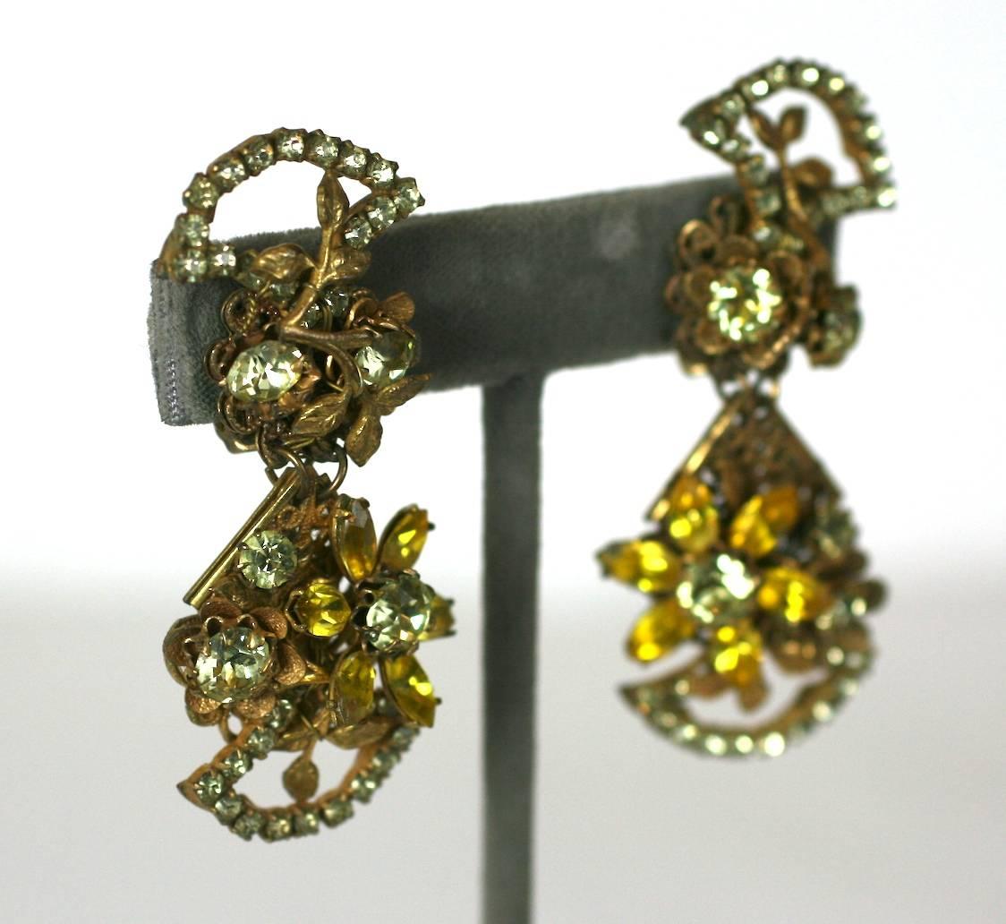 Amourelle Citrine Dangle Earrings from the 1940's. Made in the Haskell style with various paste and filigree elements hand wired onto a filigreed base. Clip back fittings. 1940's USA. 
2.5