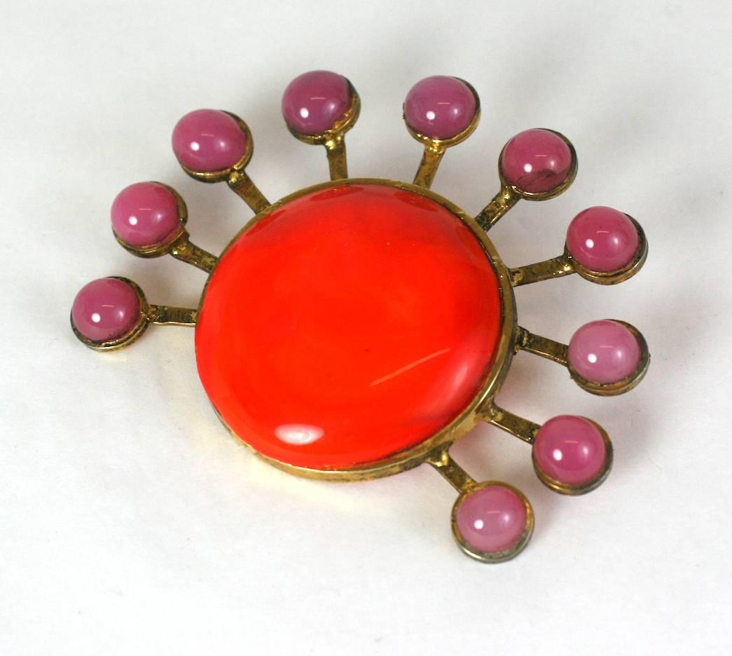 Yves Saint Laurent 1970's Maison Gripoix sun brooch. Of gilt bronze, deep rose and vivid orange poured glass paste enamel.  
1970's France. Unsigned.
Excellent Condition. 
Length 2.75"
Width 2"