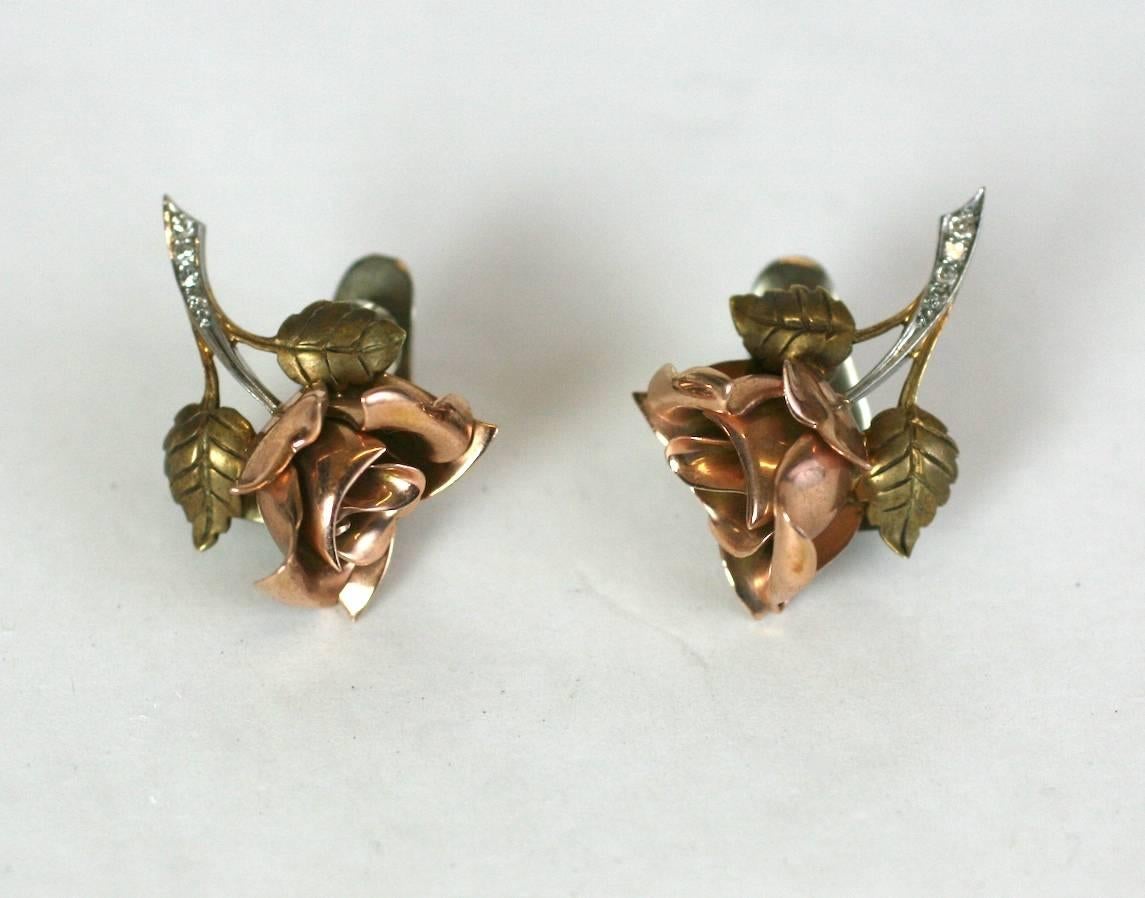 Cartier Tricolored Rose Earrings in 14k gold with clip back fitttings. 3 dimensional flowerheads are rendered in pink gold with the leaves and stems done in green 14k gold. Nice detailing with single cut diamond accents along flower stems set in