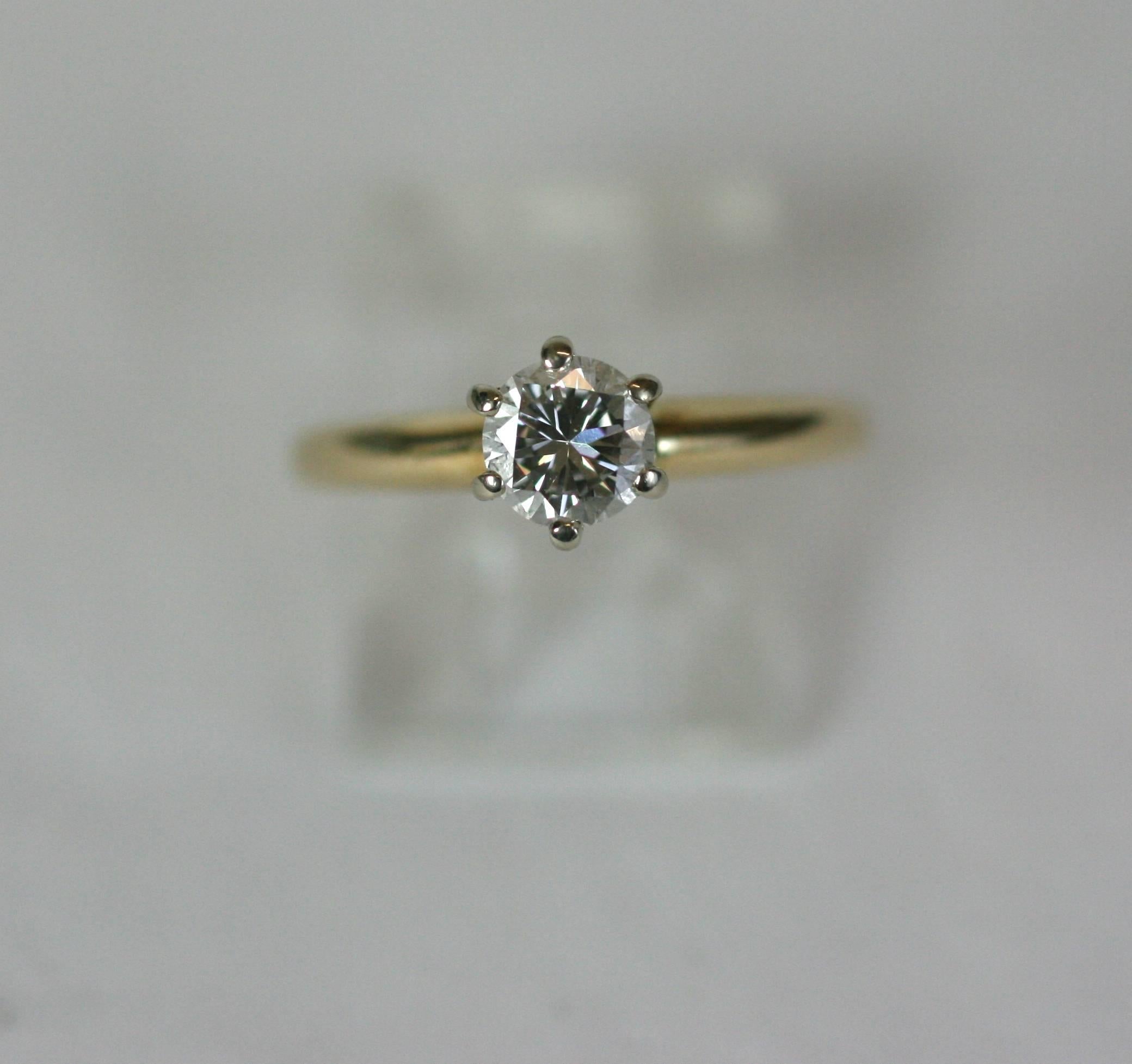 Delicate Diamond Ring, simply elegant 14k gold, 6 prong setting with beautiful, clean white diamond of almost a half carat (.45 points). Modern brilliant cut stone, (H color, VS2 quality). 
Size 5 to 5.5. 
Excellent condition. 