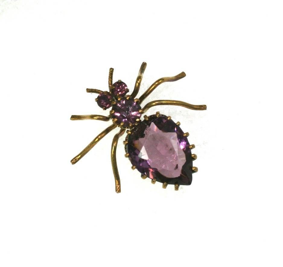 Victorian amythest crystal spider brooch of pear and round faceted stones forming the body and eyes, with multi prong claw settings. Set in gilt metal with 