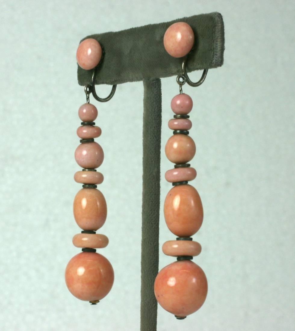 Louis Rousselet Art Deco  faux coral long earrings. Of round, oval and rondelle shaped hand made pate de verre beads with silver gilt spacer beads. Screwback fittings. 1920's France.
Excellent Condition
Length 3