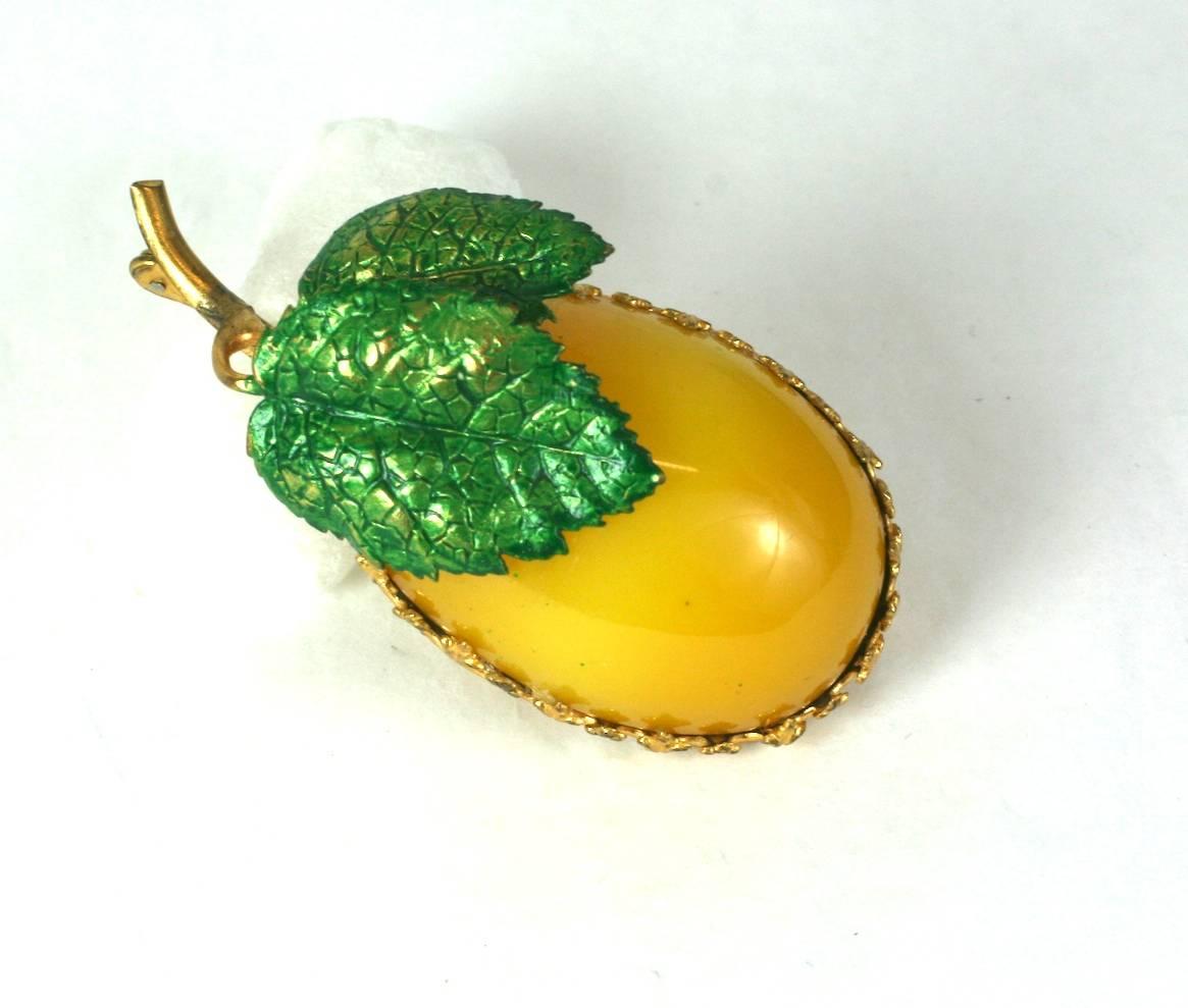 Charming Cis Plum Brooch from the 1950's. 
A large bakelite plum is set into signature Cis gilt crown settings with enameled leaves. 
France 1950's, by Countess Cis, Unsigned. 2