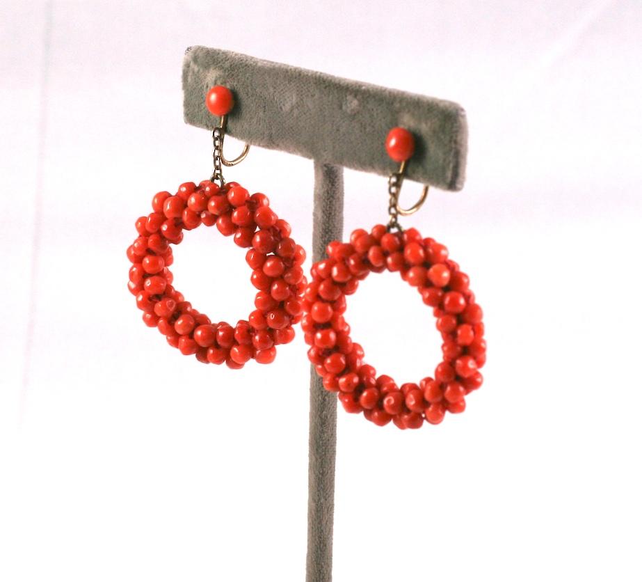 Lovely Italian coral hoop earrings with screw back fittings set in gilded silver. The coral beads are woven onto a circular wire base. 
Italy 1950's. 
2