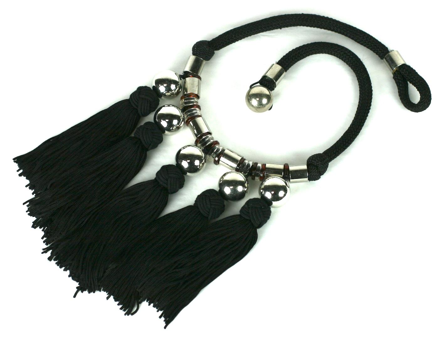 Yves Saint Laurent  Bib necklace, Haute Couture, Chinese Collection, Opium, Fall/Winter 1977. Woven silk cord, silvered metal beads, with bakelite spacers. The bib front of handmade silk knot passementerie tassels.
Made in France, Unsigned. Haute