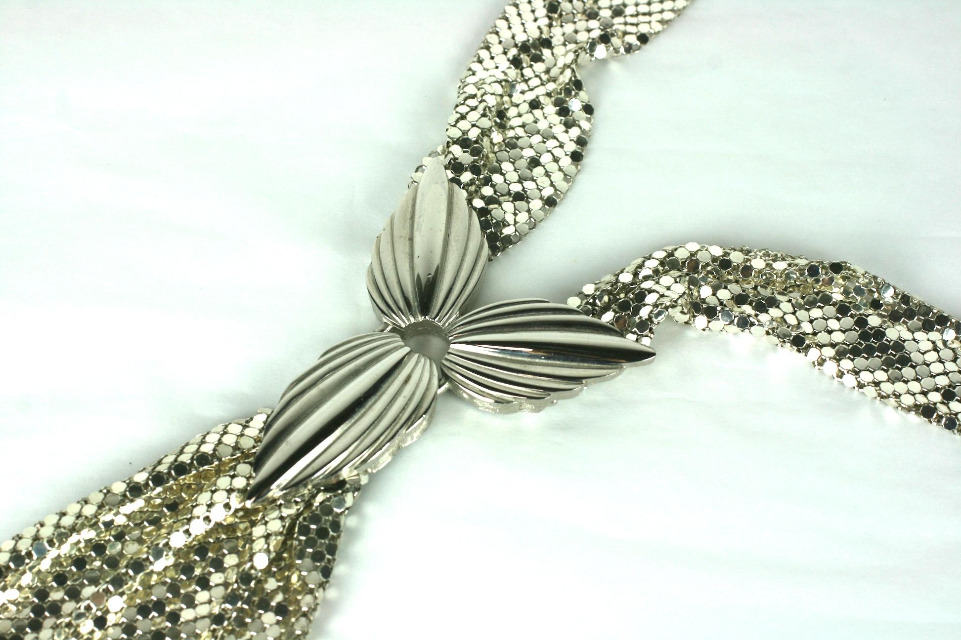 Striking and unusual tie form Whiting and Davis Metal Mesh Necklace from the 1980's. Chrome plated mesh ties are anchored by a leaf form station in front. Clasp closure on back of necklace. 
1980's USA. Signed. 22