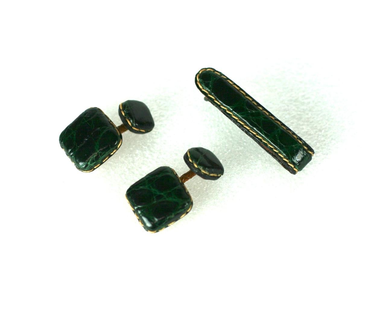 French forest green alligator cufflinks and tie bar set. Hand stitched, the cufflink shanks of finely braided leather.
Made in France. 1940's. Excellent Condition. 
Cufflinks
Length 1