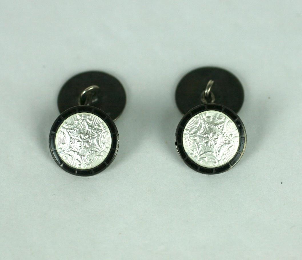 Sterling and Enamel Deco Links in white and black enamel. Floral swag patterns are engraved under the transluscent white guilloche enamel and are then bordered in black. 
Marked 