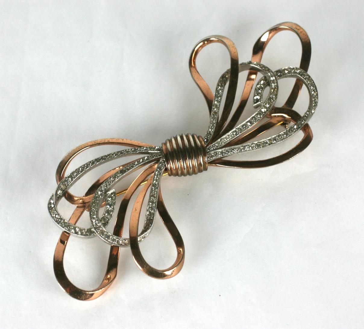 lmpressively scaled, Pennino sterling vermeil rose gold and crystal diamante looping bow retro brooch.  1940's USA.  Excellent Condition
Length 4.50