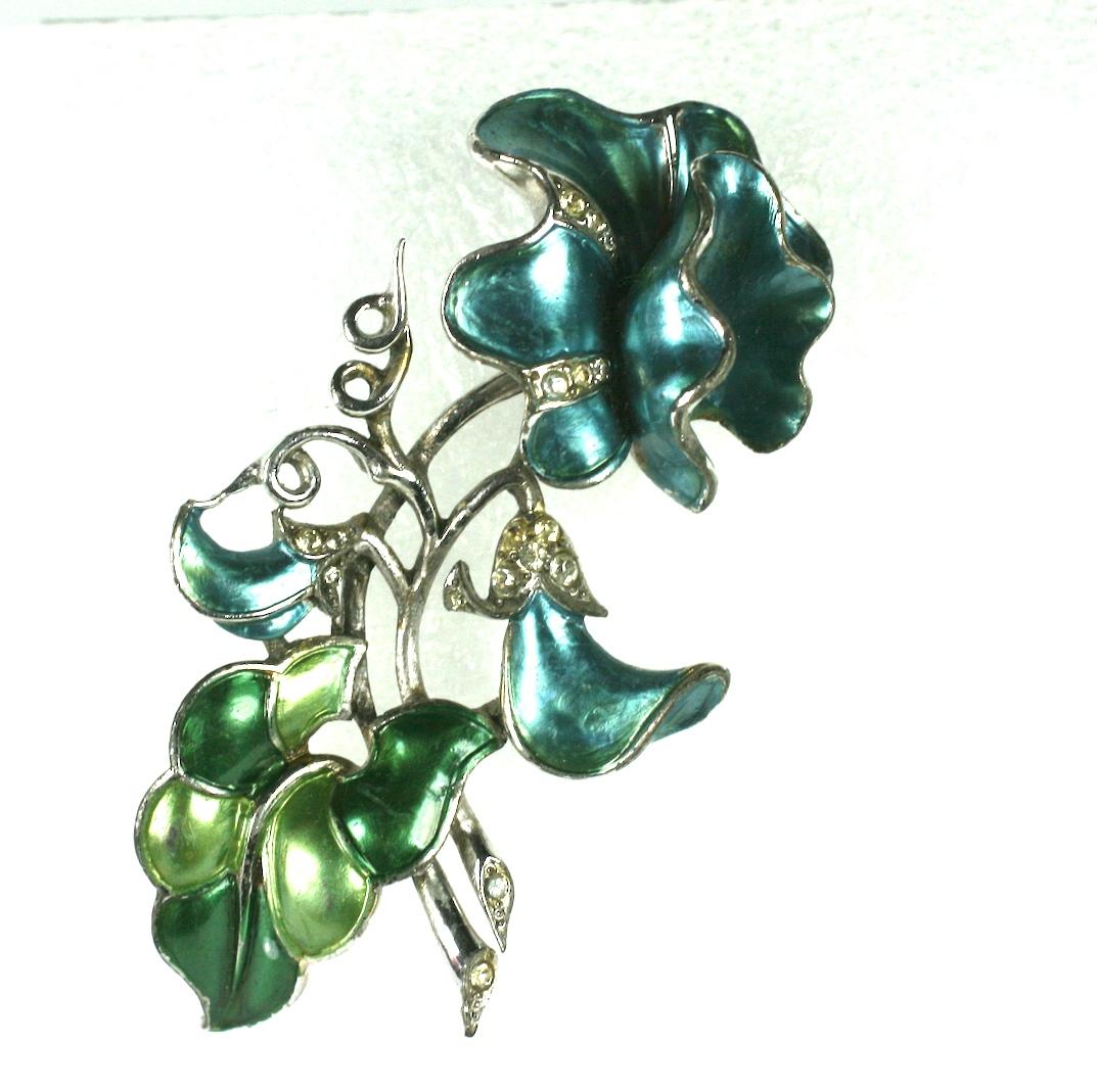  Marcel Boucher's rare sweet pea brooch with bright blue and vari shades of green pearlized enamel with crystal rhinestones accents.  Made of rhodium plated metal from Marcel Bouchers 1941 collectible, metallic enamel series. 
Marked: MB (phrygian