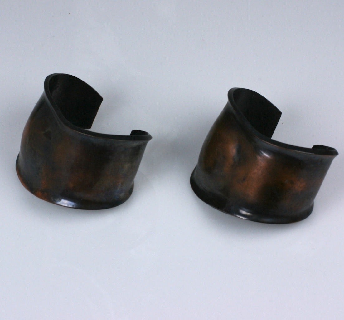 Pair of Peretti Style Modernist Copper Cuffs which follow the contours of the wrist. A bump on the cuff simulates the wristbone
