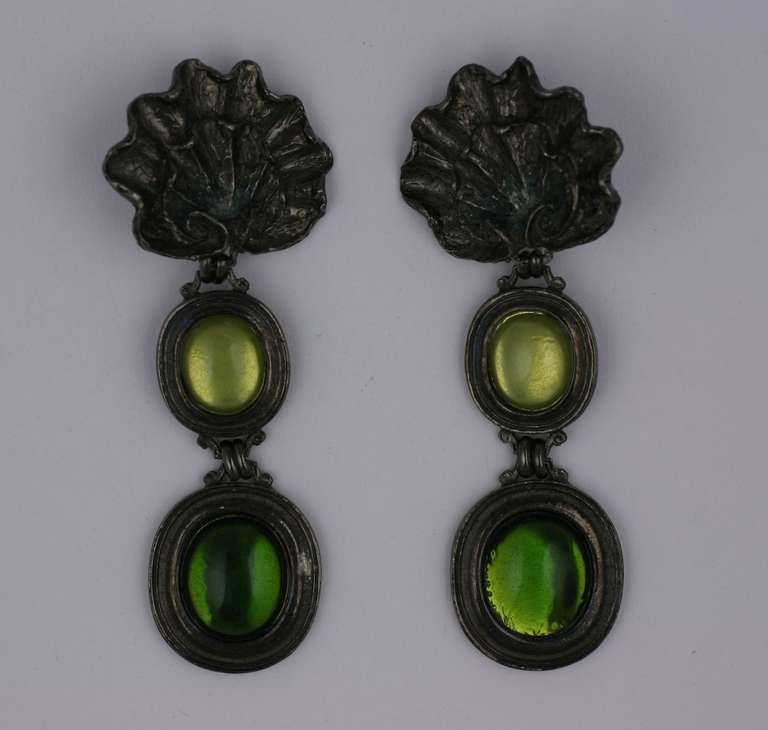 Dramatic YSL earrings in deep gunmetal finish with pâté de verre cabochons in peridot and olivine tones which are mirror backed. 4.75
