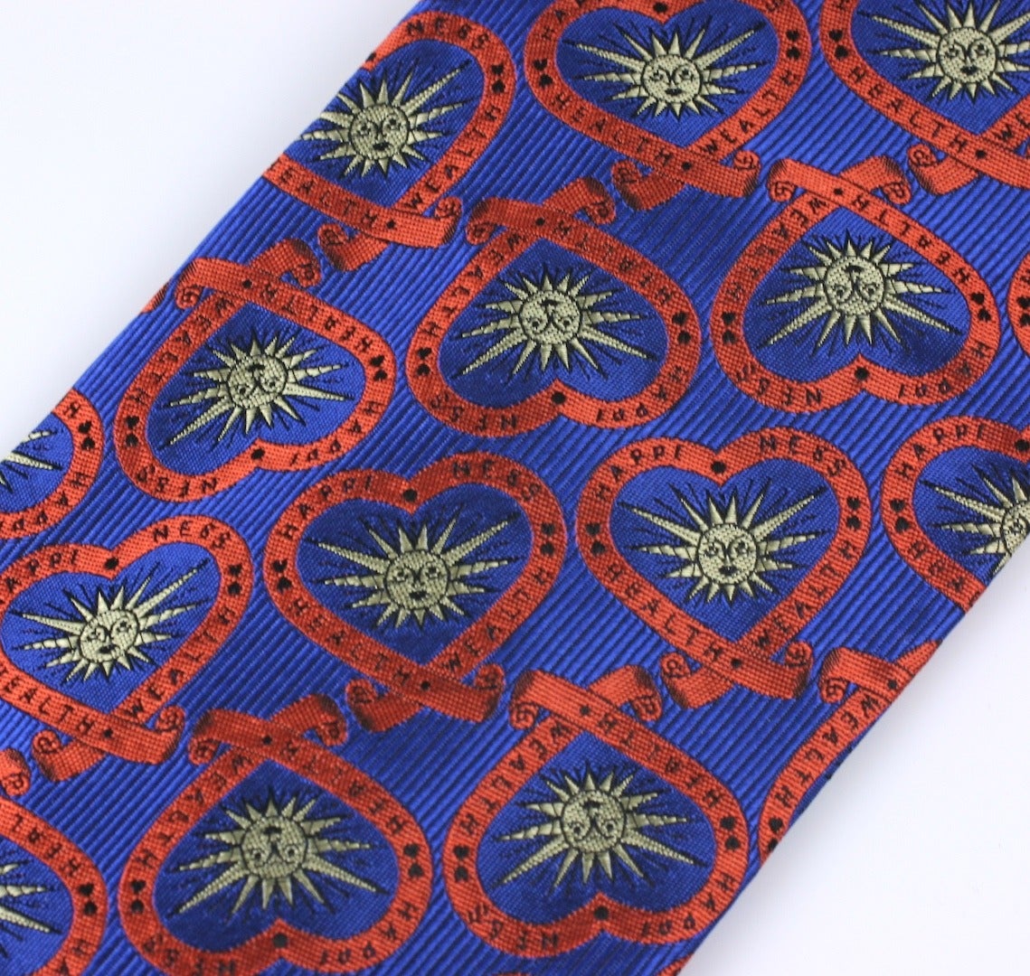 Moschino Heart Motif Tie with woven expressions of Happiness, Health and Wealth all surrounding an abstract sun motif. 
2000's Italy. Excellent condition, unworn.