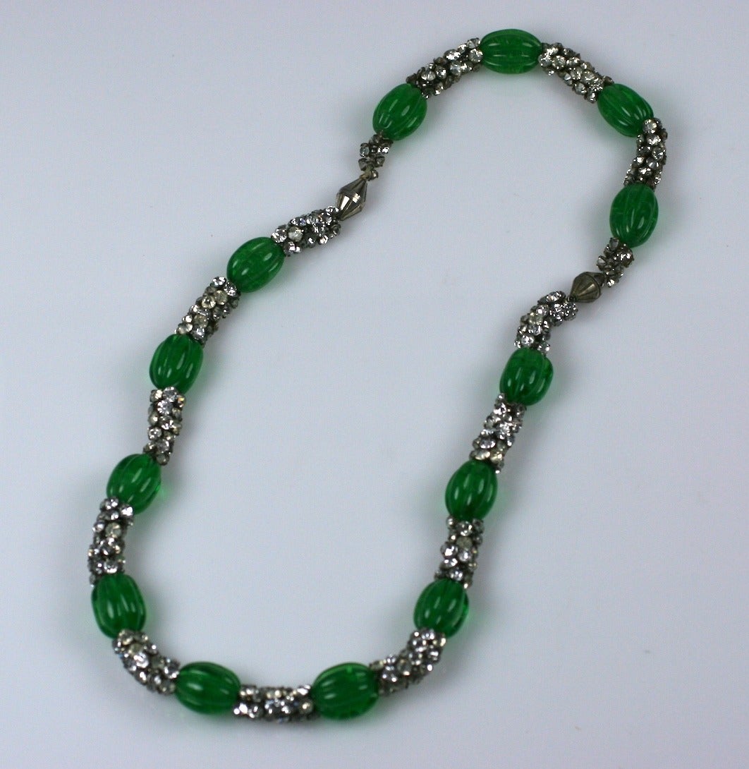 Maison Gripoix Art Deco Emerald Pate de Verre Suite of fluted hand made beads strung with hundreds of tiny paste stations for a very rich effect. Both pieces can be combined to form a longer necklace if desired. Very elegant and French. 
1930's