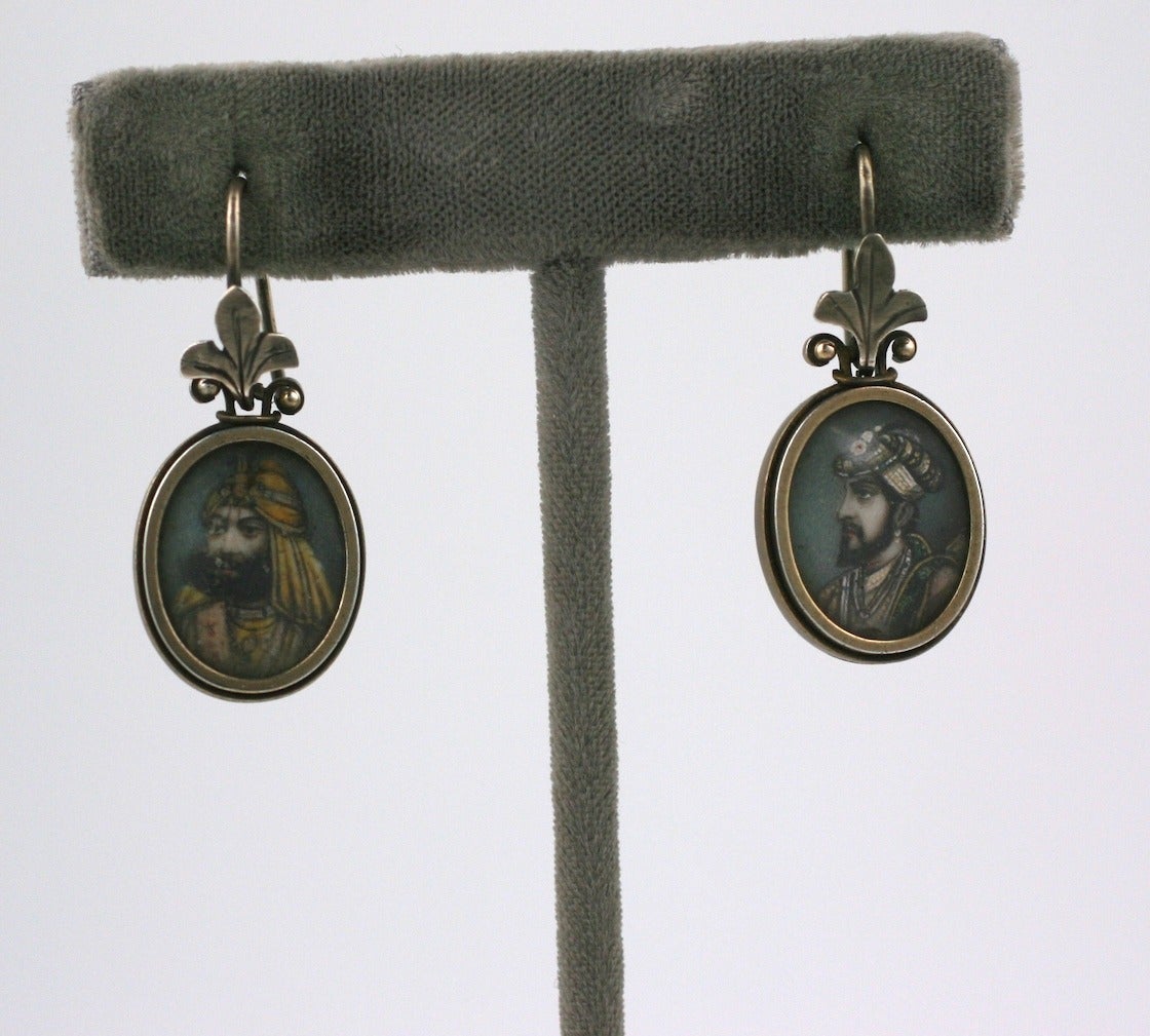 Charming Victorian earrings with hand painted miniatures of Indian noblemen on each. Set in silver with a gold edge around frame. These were presumably made for export in the late 19th Century and are unusual in earring form. Pins and bracelets are