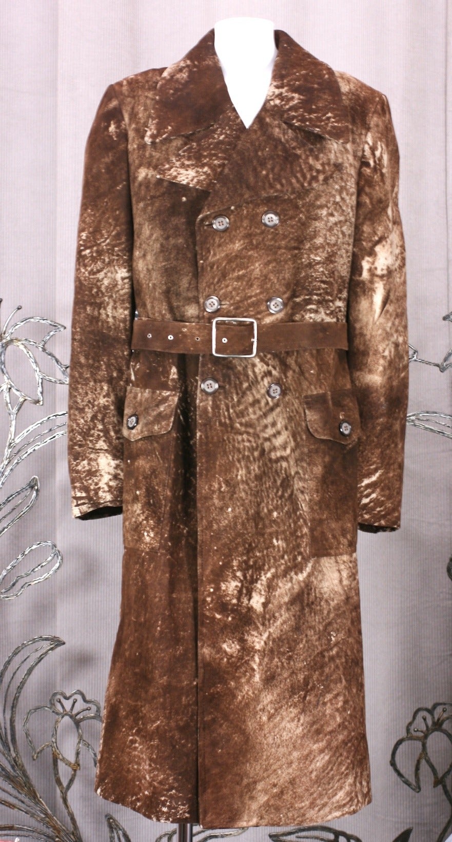 Amazing trompe l'oiel mens double breasted belted coat in suede printed to look like pony skin. Strong shouldered, long and lean cut with large patch pockets on hips and matching belt. 
An incredibly elegant coat which can be styled in so many