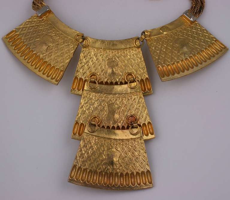 Alexis Kirk's Eygptian Collar of gilt patterned metal plaques with large faux lapis cabochons. 16