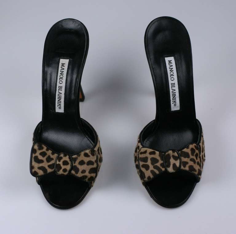 Manolo Blahnik's timeless leopard printed ponyskin mules with pussycat bow. Excellent condition. Size 36.5, 2000's UK.