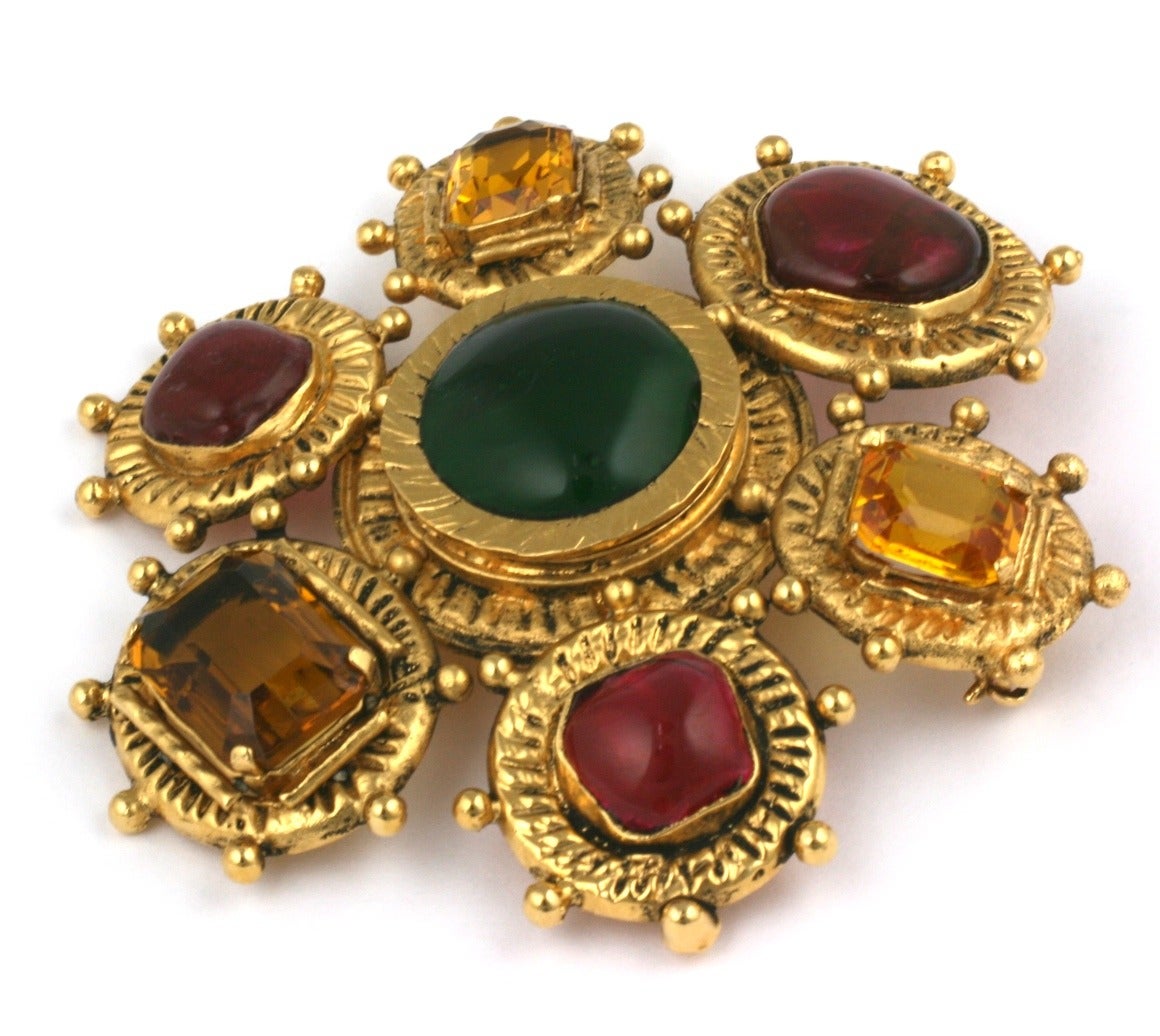 Chanel byzantine style crest brooch by Maison Gripoix. Poured glass emerald and ruby oval and heart shape cabochons are mixed with faceted cut topaz stones. Also has pendant hook fitting. 
Signed Chanel, 1980's France. 
Very Good condition.
L3