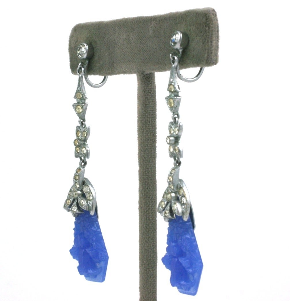 Art deco articulated crystal pave long earrings set in rhodium metal with pendants of faux carved chalcedony pate de verre. Screw back fittings.
1920's Czech.  Excellent condition.