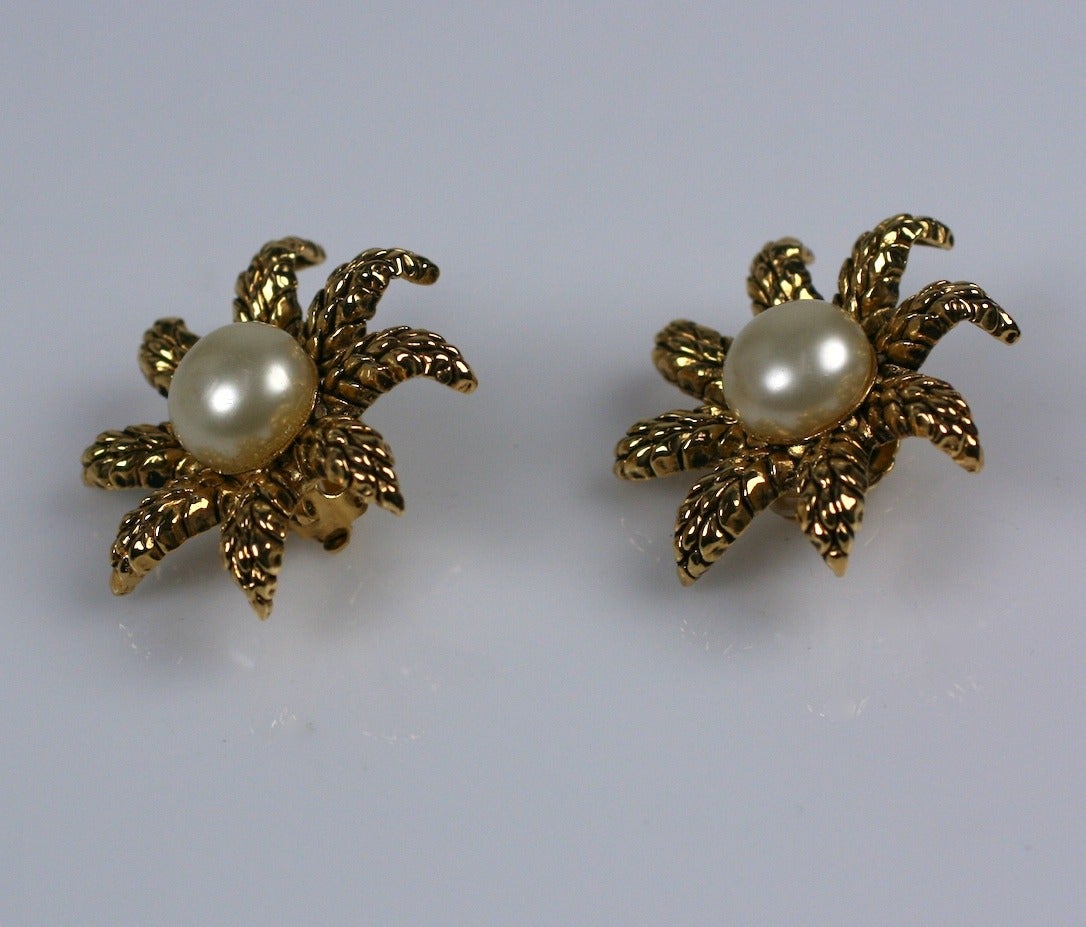 Chanel Star earrings with wheat texture around a large handmade pearl by Maison Gripoix. France 1980's. 2