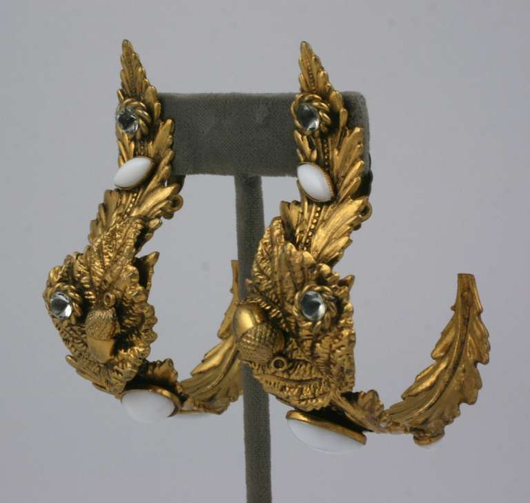 Dominique Aurientis Baroque ear clips  of white and crystal pate de verre and gilt metal. Large baroque leaves are curled and set with stones, 1980's France. Unsigned. 
Length 3