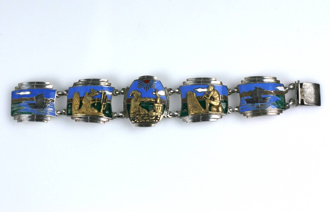 Beautiful and unusual Art Deco Panel bracelet in sterling silver with hard enamel and bronze/brass applications. The 3 central panels depict scenes of Pre Columbian life in stepped Art Deco frames. The backgrounds are beautifully enameled in color