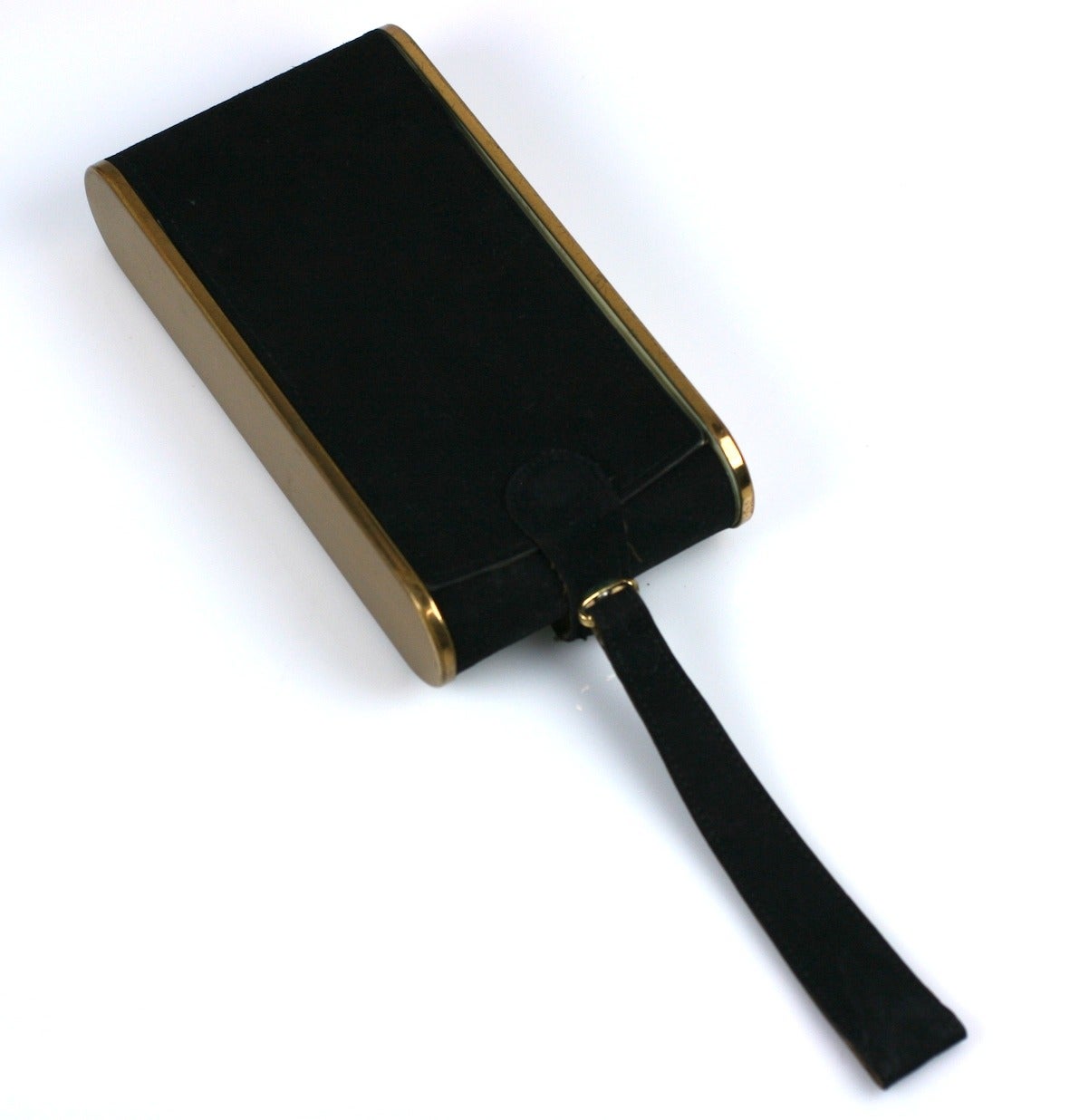 Wadsworth black antelope suede and gilt metal surealist figural minaudière.
The early camera shape with attached strap handle, interior mirror,and multiple fitted compartments. 1950's USA.