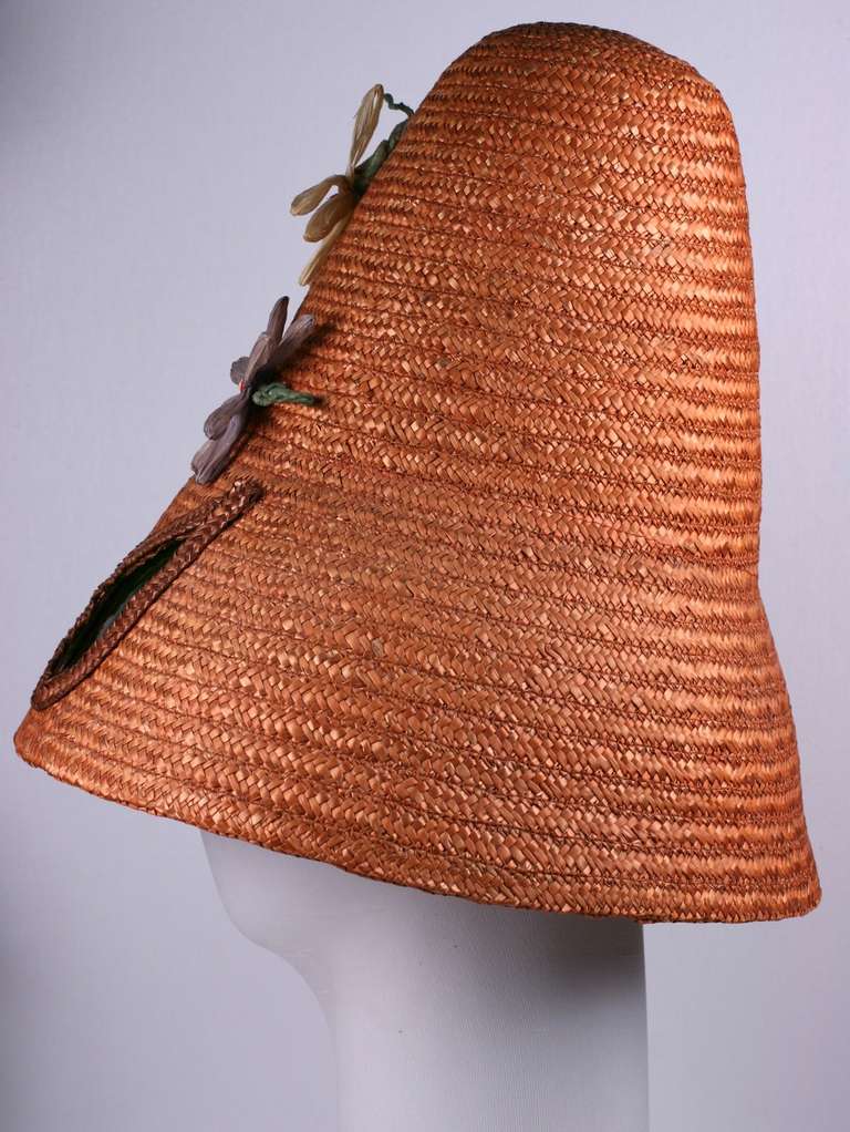 Charming novelty hat from the 1960's, Italy. Hand woven pumpkin straw is inserted with cut outs for green cellophane 